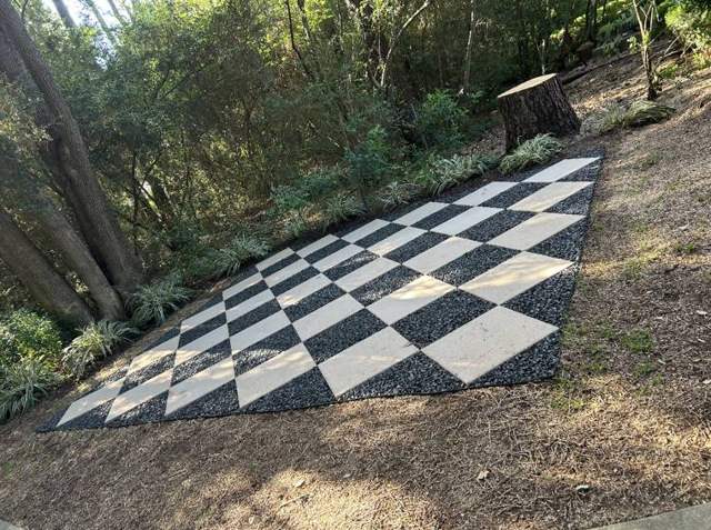 Checkerboard paver and gravel pad