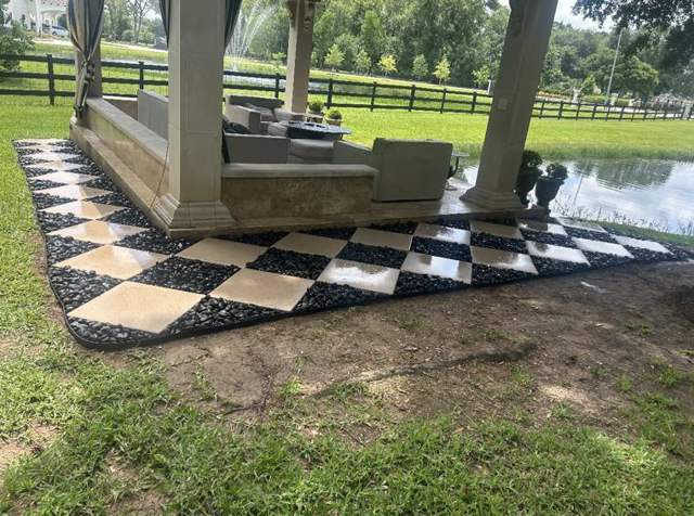 Checkerboard pavers around a pavilion