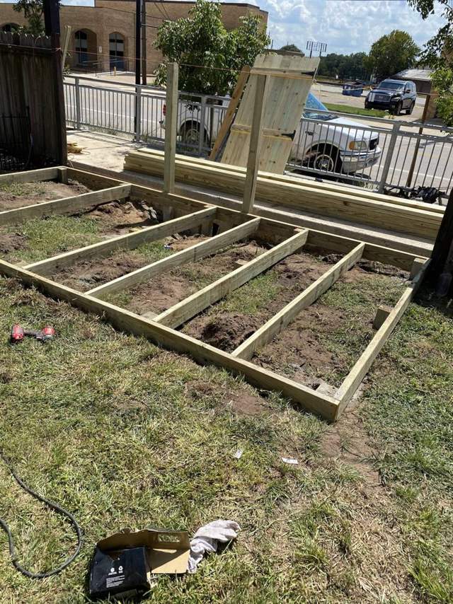 Deck frame with joists set over the ground